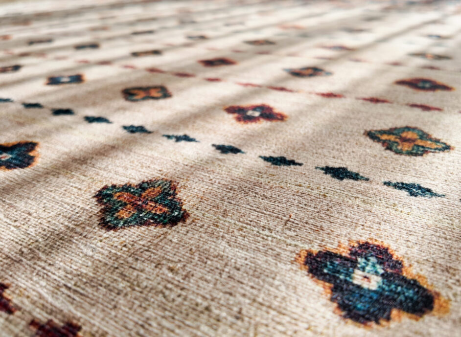 Close-up of patterned carpet shows detail and texture,